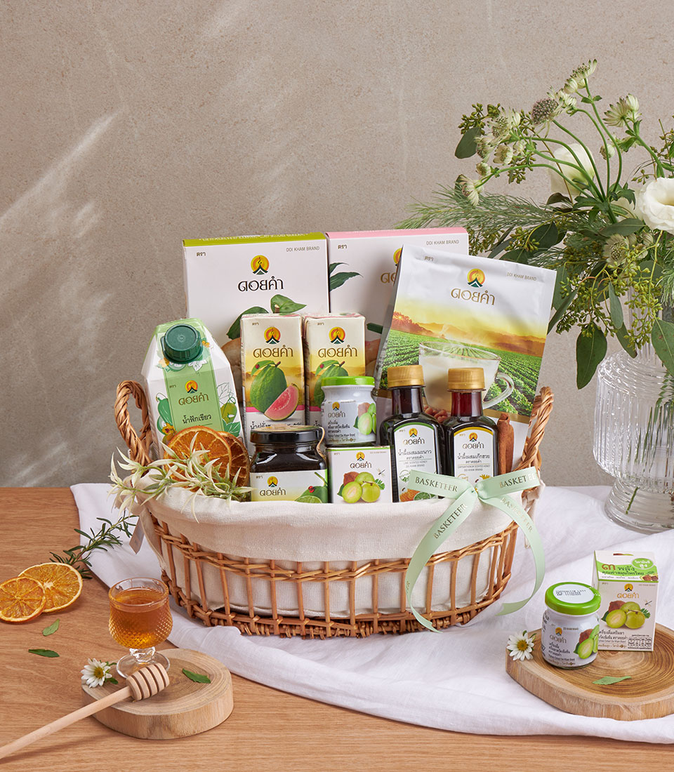 Full view of doi kham healthy gift basket with assorted snacks and drinks in a woven basket.