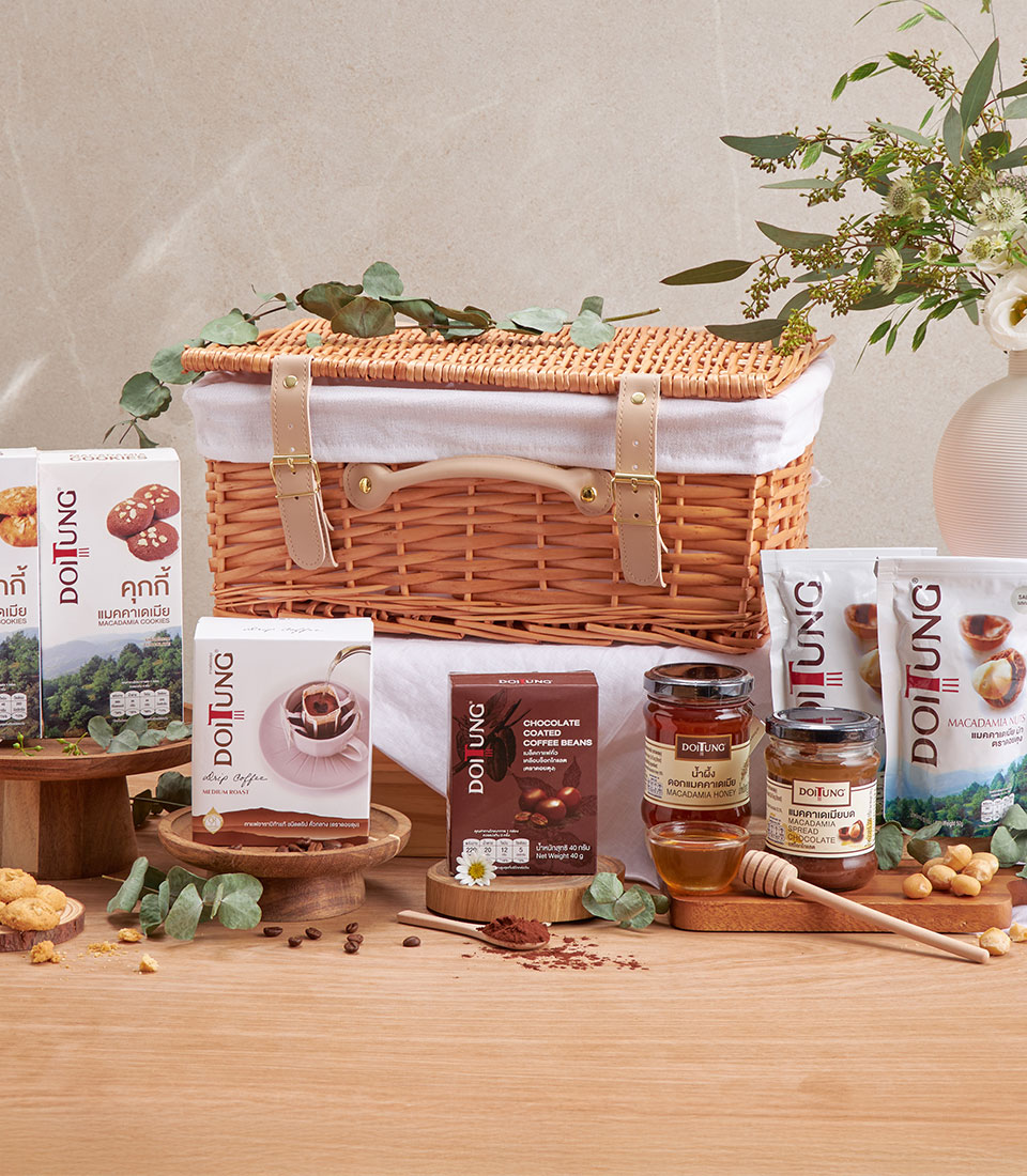 Full view of doitung macadamia coffee & chocolate basket with assorted snacks and drinks in a woven basket.