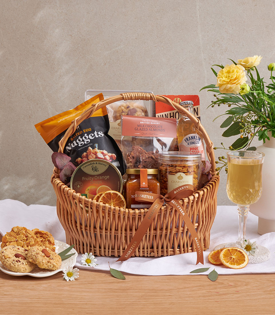 Premium gourmet gift basket with assorted snacks, beverages and specialty items.