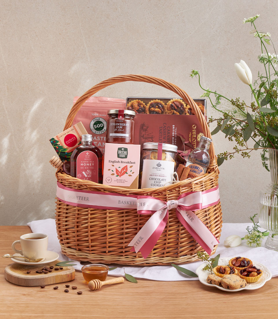 Premium gourmet gift basket with assorted snacks, beverages and specialty items.