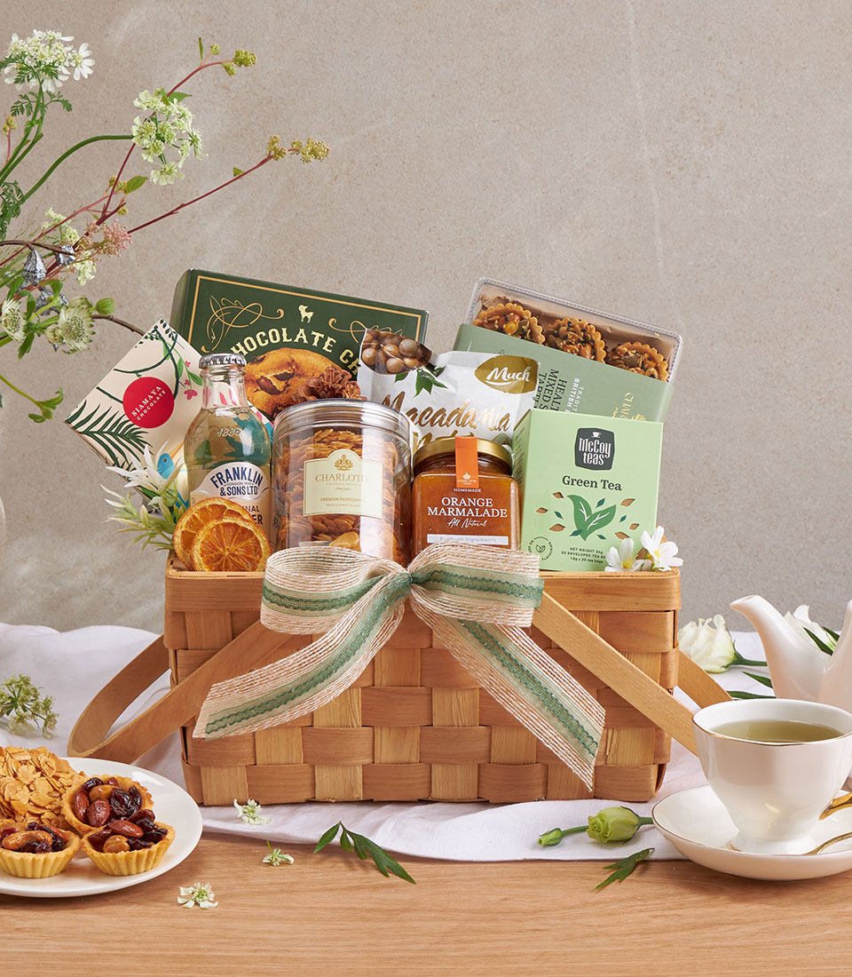 Premium gourmet gift basket with assorted snacks, beverages and specialty items.