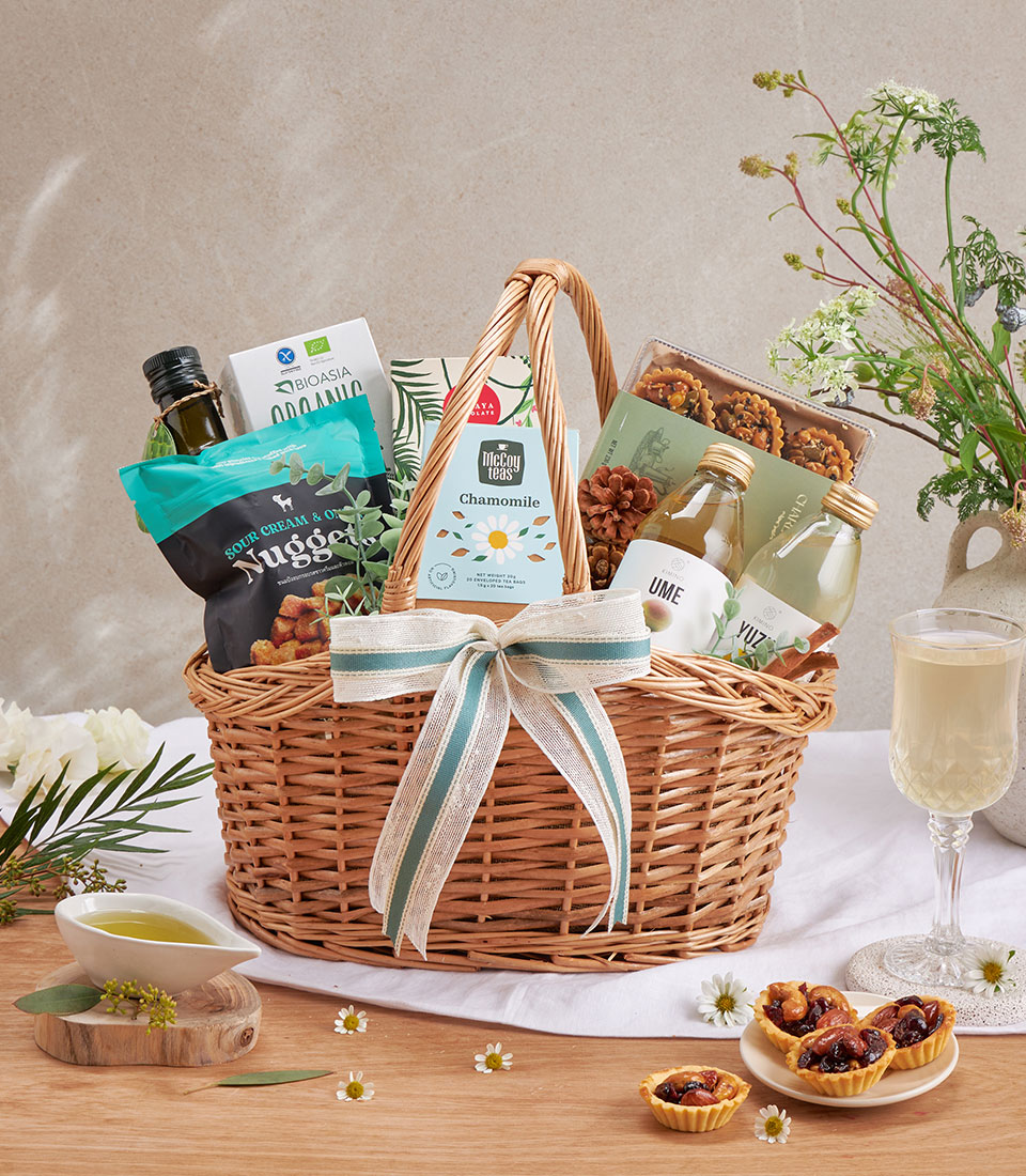 Premium gourmet gift basket with assorted snacks, beverages and specialty items.