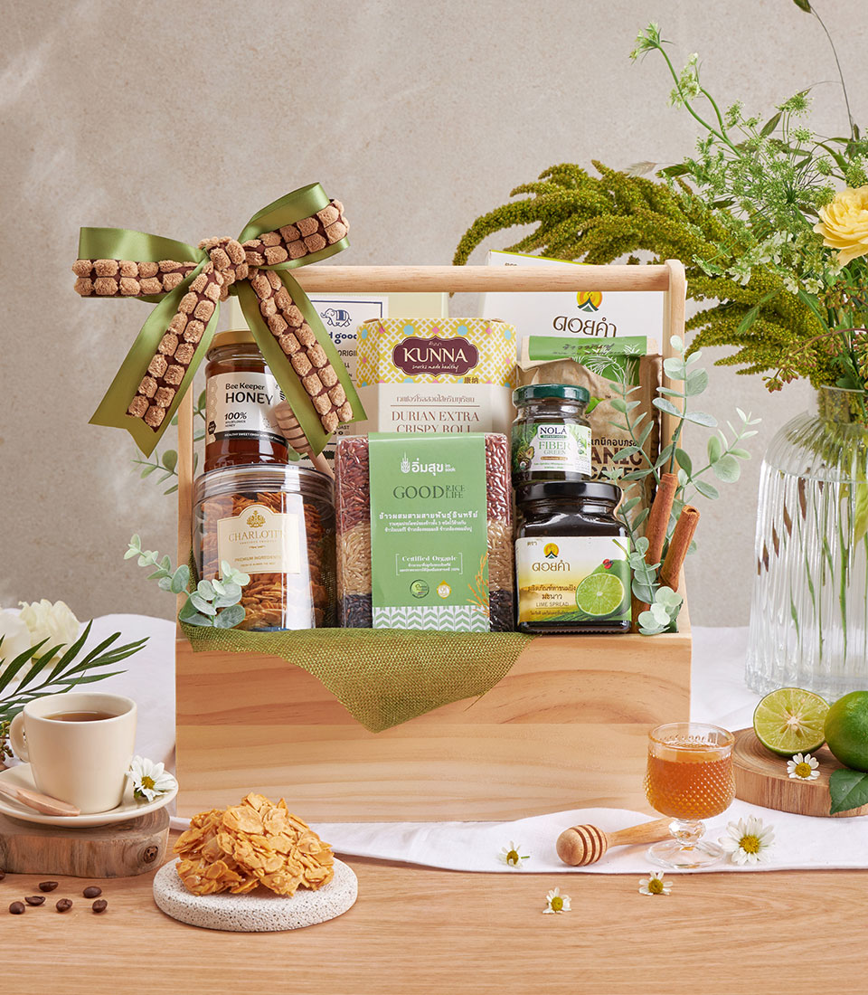 Healthy wellness gift basket with assorted healthy snacks in a wooden box.