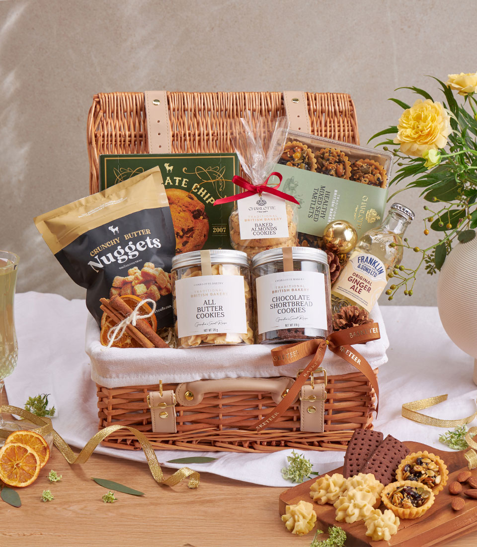 Premium gourmet gift basket with assorted snacks, beverages and specialty items.