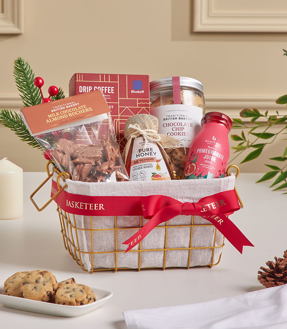 Golden mini gourmet gift basket with cookies, coffee, honey, and sweet treats.