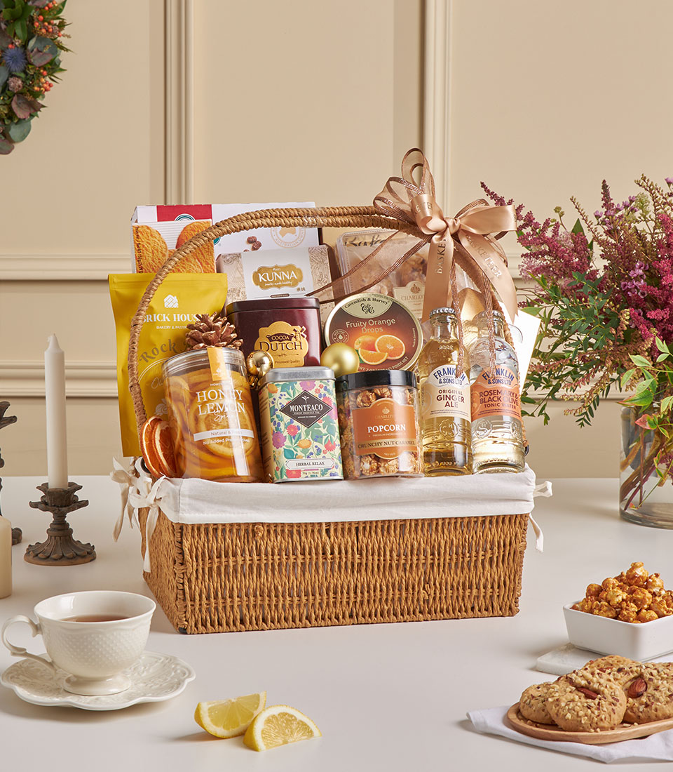 Luxury golden healthy gift basket in wicker hamper with premium wellness treats and elegant ribbon styling.