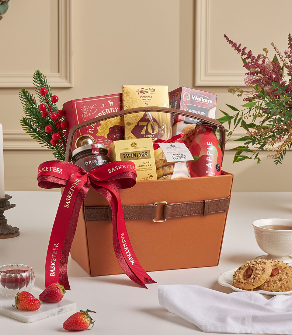 Luxury leather gift basket with red gourmet treats, premium festive presentation.