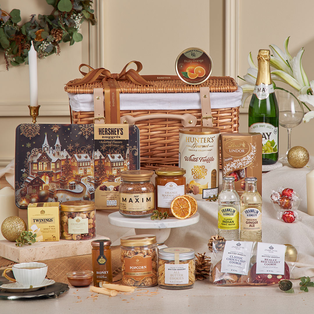 Picnic collection gift basket by Basketeer, featuring a wicker picnic hamper filled with chocolates, cookies, tea, honey, marmalade, popcorn, truffle chips, and non-alcoholic sparkling drink — ideal for New Year gifting and gourmet celebrations in Bangkok, Thailand.