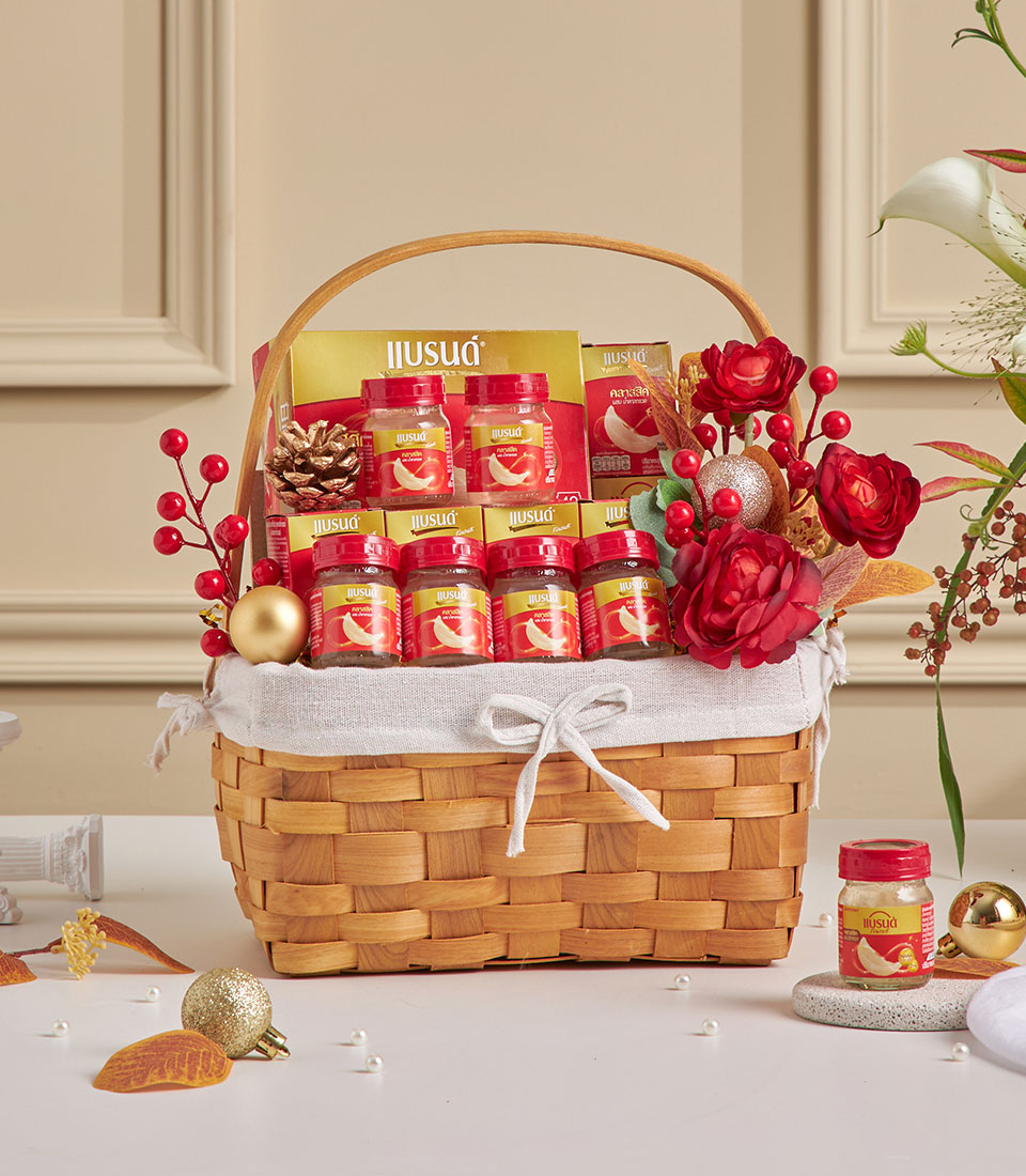 Red bird’s nest wellness gift basket with festive red-and-gold design.