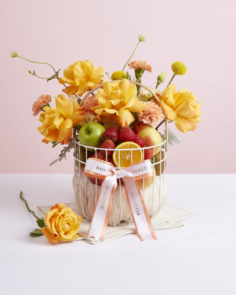 Thank You fruit basket with fresh fruits and orange rose floral arrangement from Basketeer.