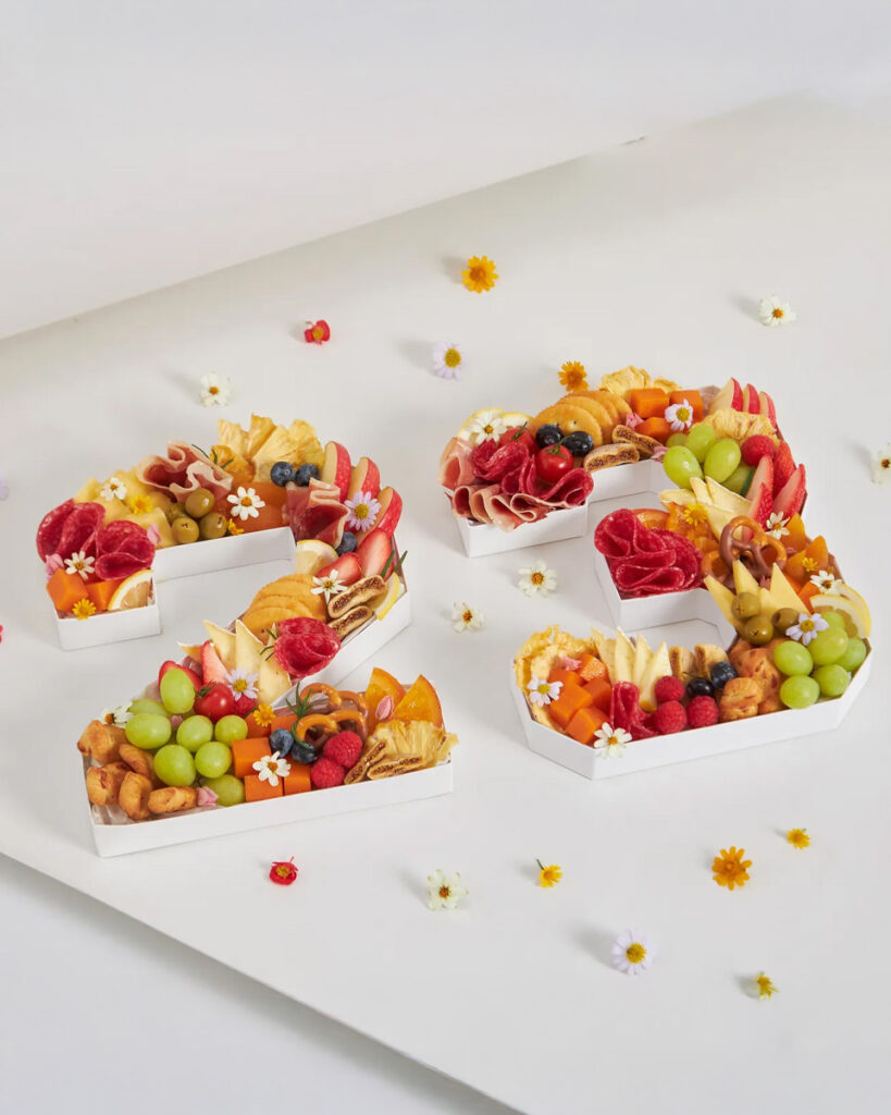 Birthday fruit and grazing box arranged in number shapes with premium fruits, cheeses, and cold cuts from Basketeer Bangkok.
