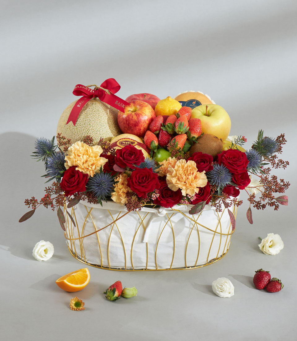 Gourmet fruit and red rose gift basket.