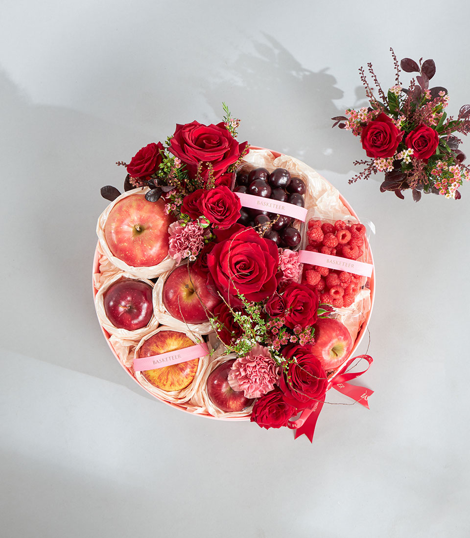 Premium fresh red rose fruit box arrangement.