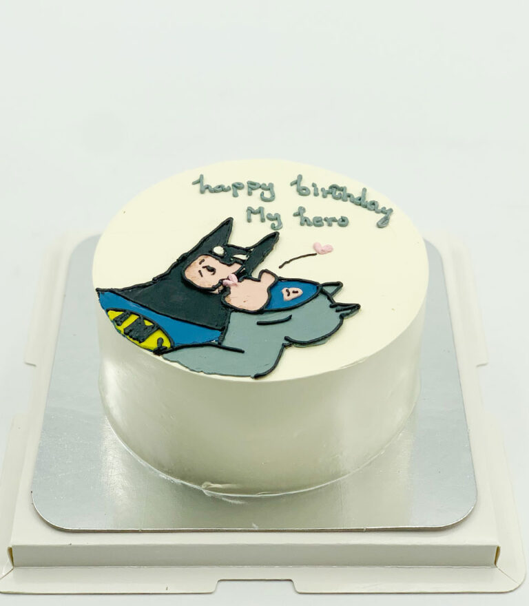Batman-themed birthday cake with cute illustration by Charlotte Bakery