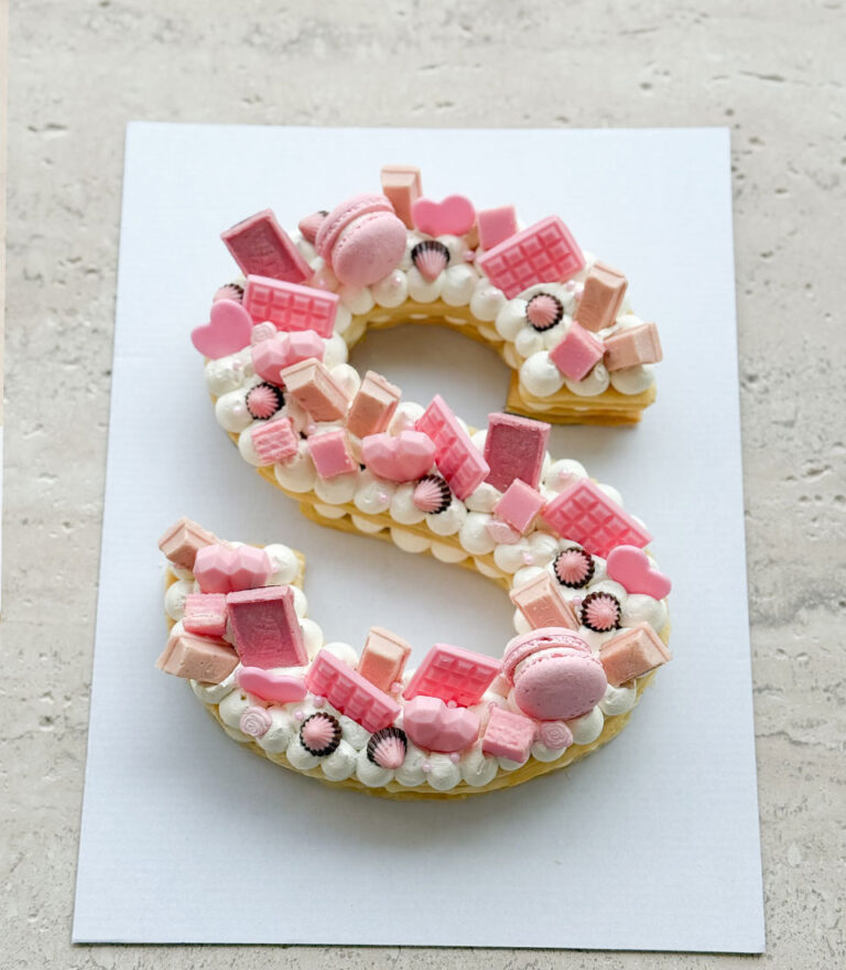 Custom message letter cake crafted with traditional sponge by Charlotte Bakery.