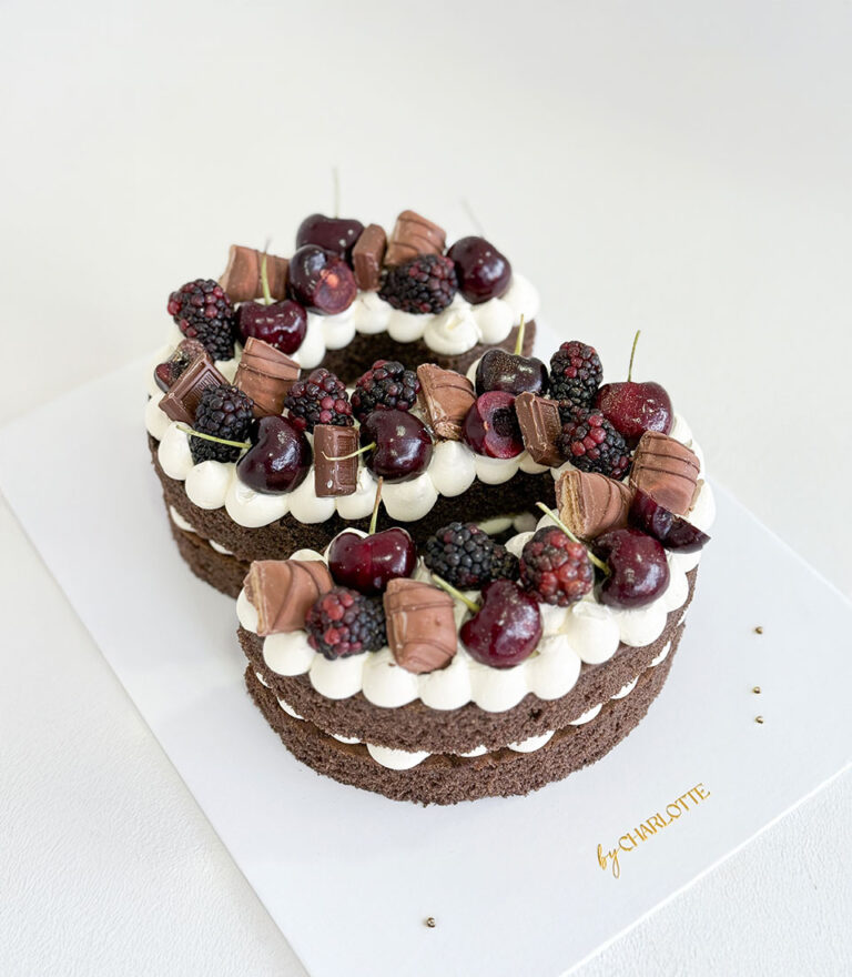 Letter cake from Charlotte Bakery topped with fresh fruit and light cream.