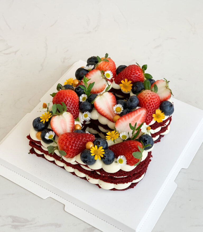 Handmade letter cake by Charlotte Bakery using traditional sponge methods.