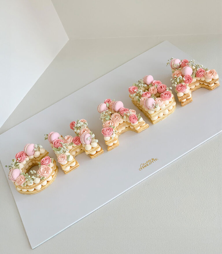 Letter cake from Charlotte Bakery finished with a simple, clean design.