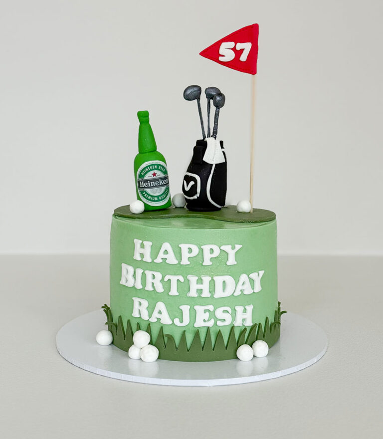 Golf-themed fondant birthday cake with clubs and flag details by Charlotte Bakery in Bangkok.