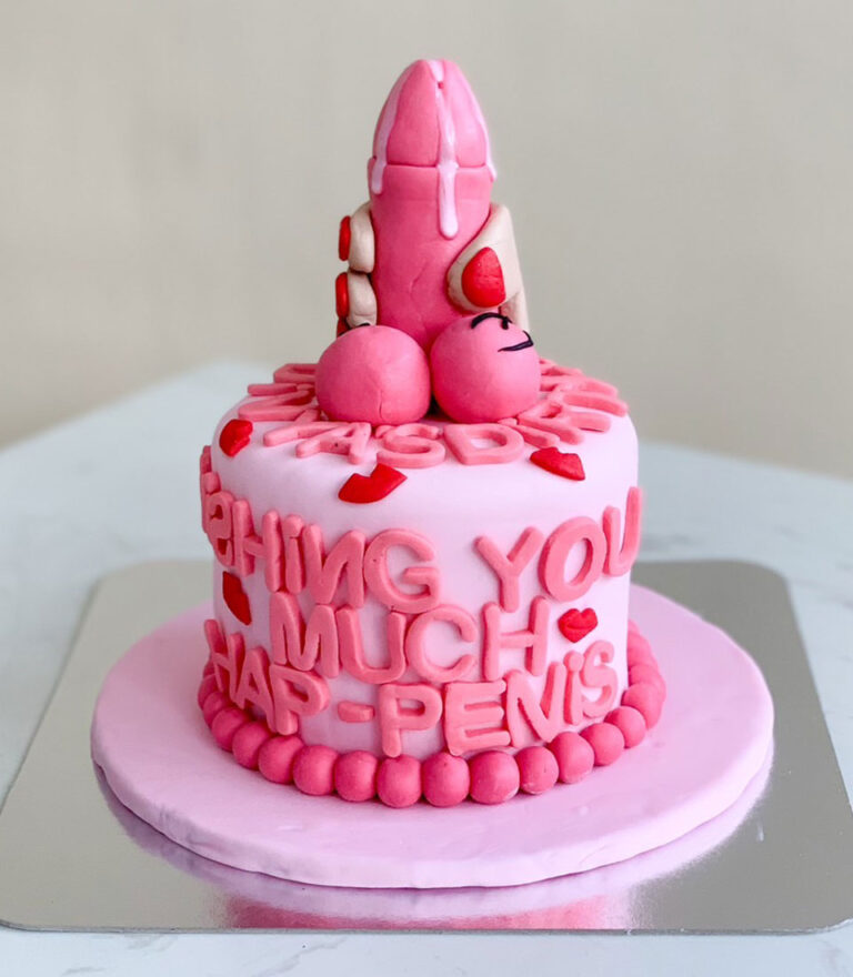 Pink novelty fondant cake with bold sculpted details by Charlotte Bakery in Bangkok.