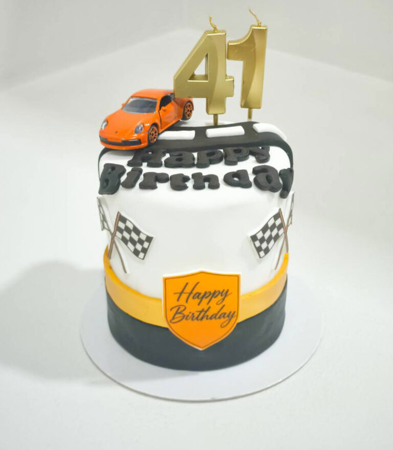 Custom birthday cake with racing car topper and number 41 detail by Charlotte Bakery in Bangkok.