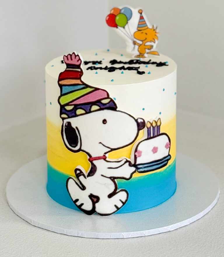 Snoopy illustration birthday cake with colorful gradient finish by Charlotte Bakery in Bangkok.