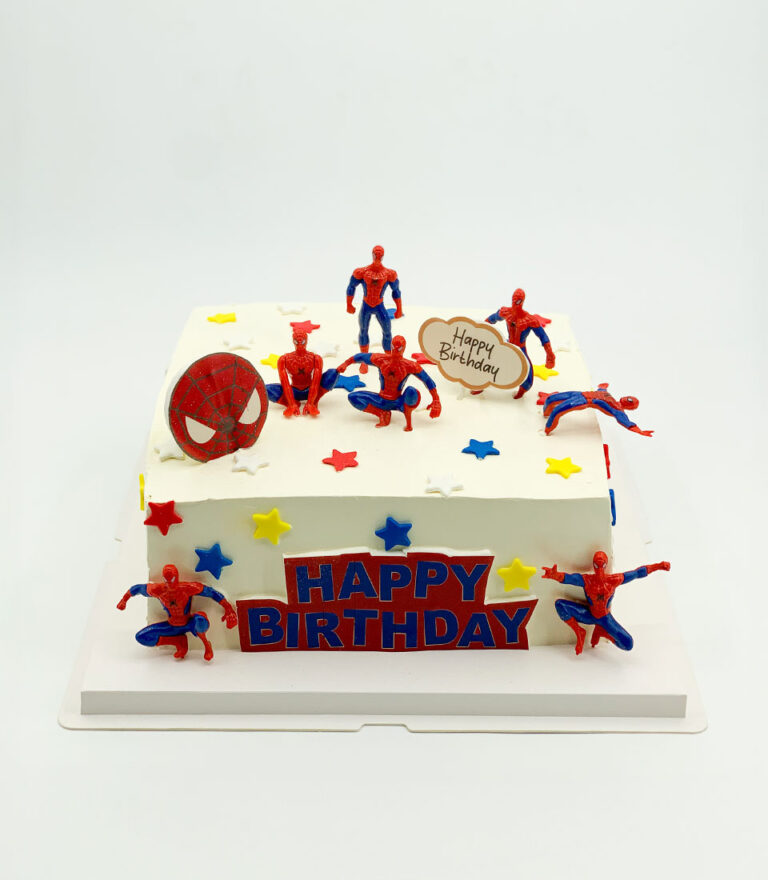 Spider-Man party birthday cake with figurines and colourful star details by Charlotte Bakery in Bangkok