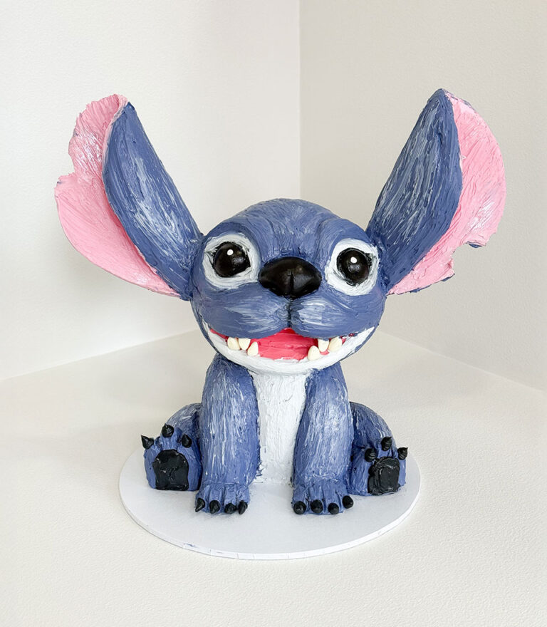 Hand-sculpted Stitch character birthday cake with painted buttercream details by Charlotte Bakery in Bangkok