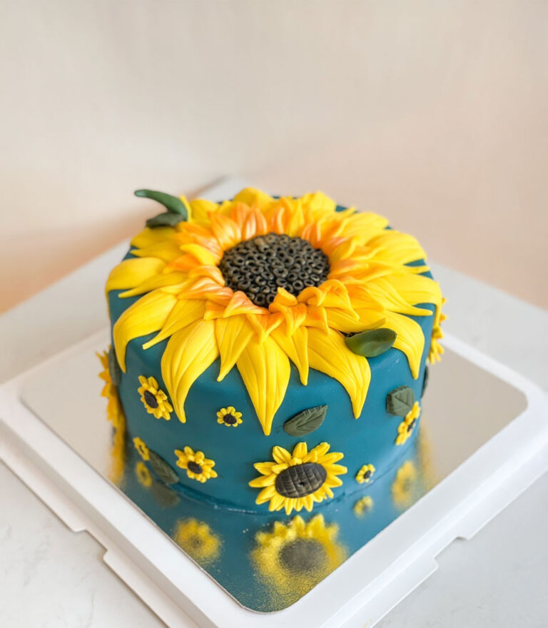 Birthday cake decorated with handcrafted sunflower details by Charlotte Bakery in Bangkok