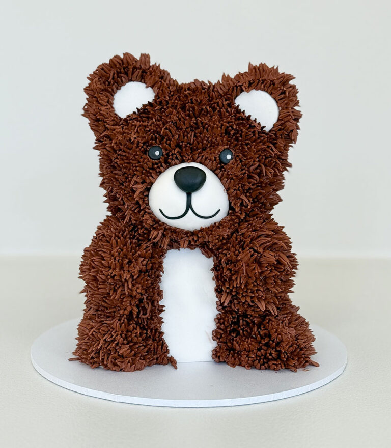 Hand-piped teddy bear birthday cake with textured chocolate buttercream by Charlotte Bakery in Bangkok