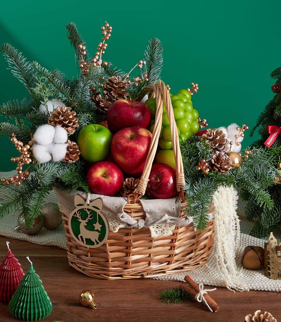 Christmas gourmet fruit basket with festive decor