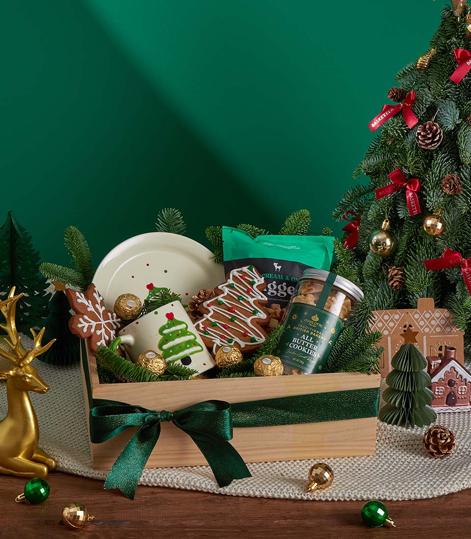 Cozy festive Christmas gift box with mug and cookies