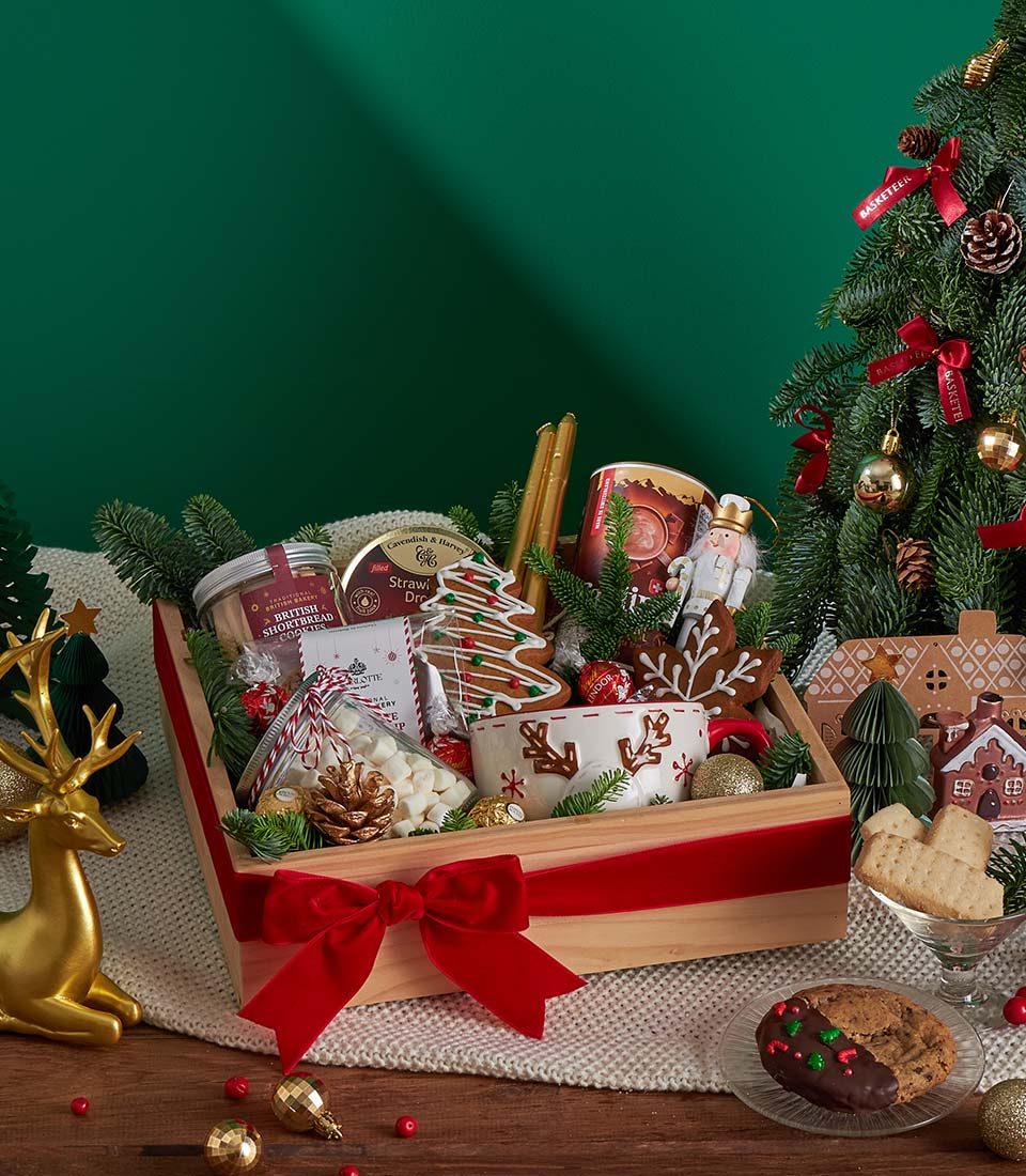 Festive holiday cocoa gift box with Christmas mug.