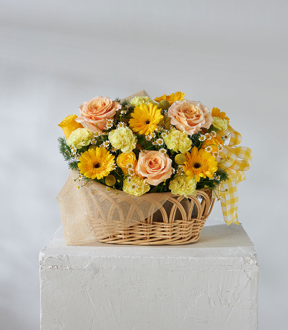 Yellow and peach flower basket with roses and gerberas, designed for joyful luxury gifting in Bangkok.