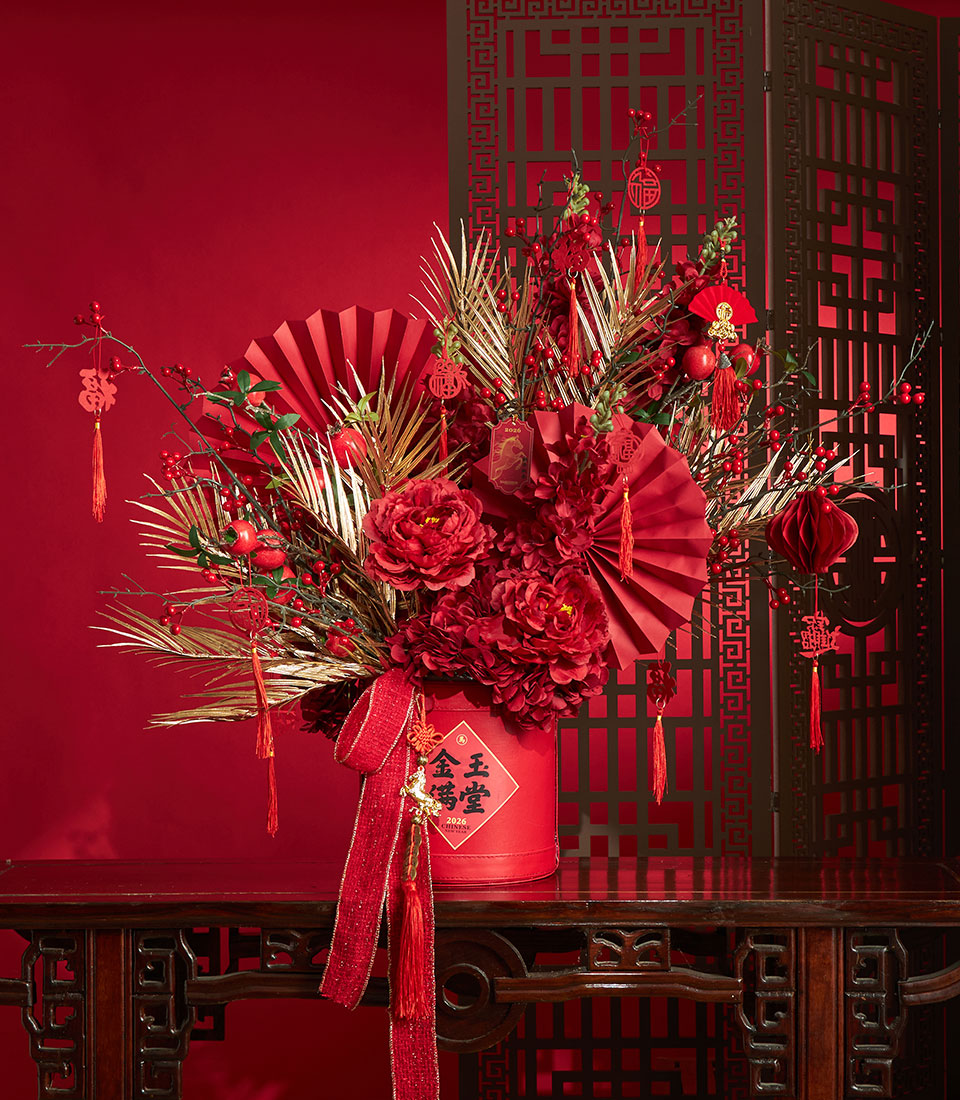 Chinese New Year artificial flower vase arrangement in red and gold tones