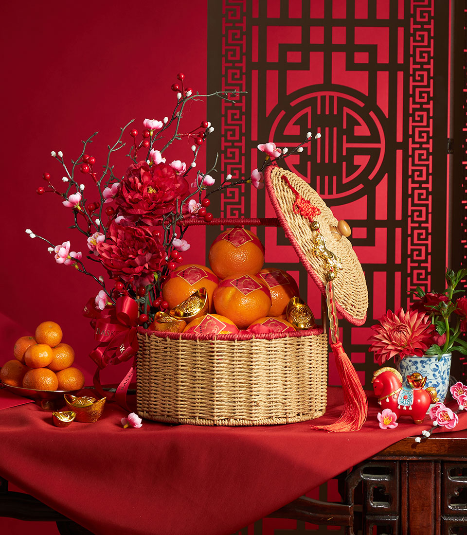 Auspicious Chinese New Year oranges hamper with red and gold decorations in Bangkok