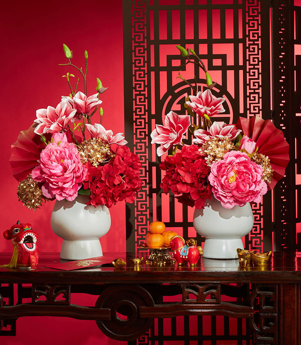 Chinese New Year artificial flower vase arrangement in red and pink tones