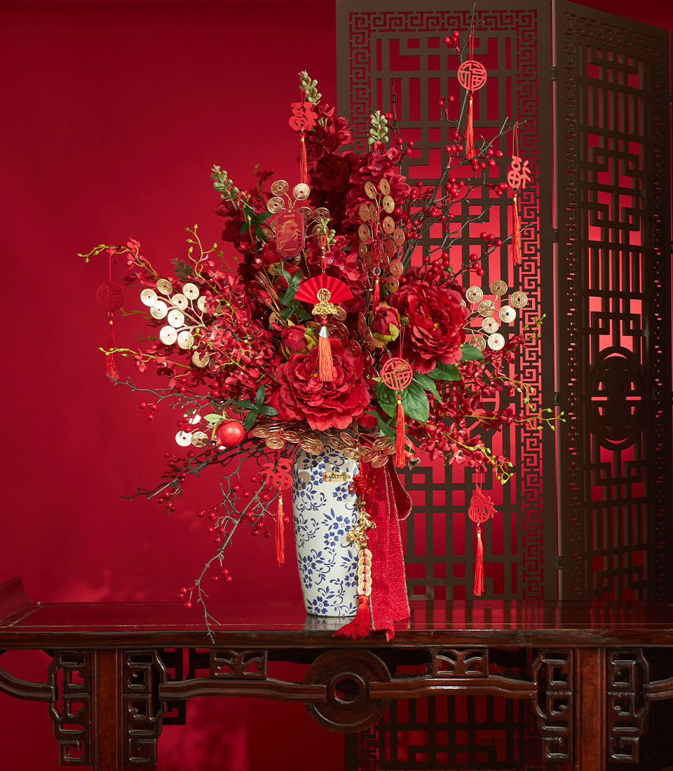 Chinese New Year red artificial peonies vase arrangement with festive ornaments