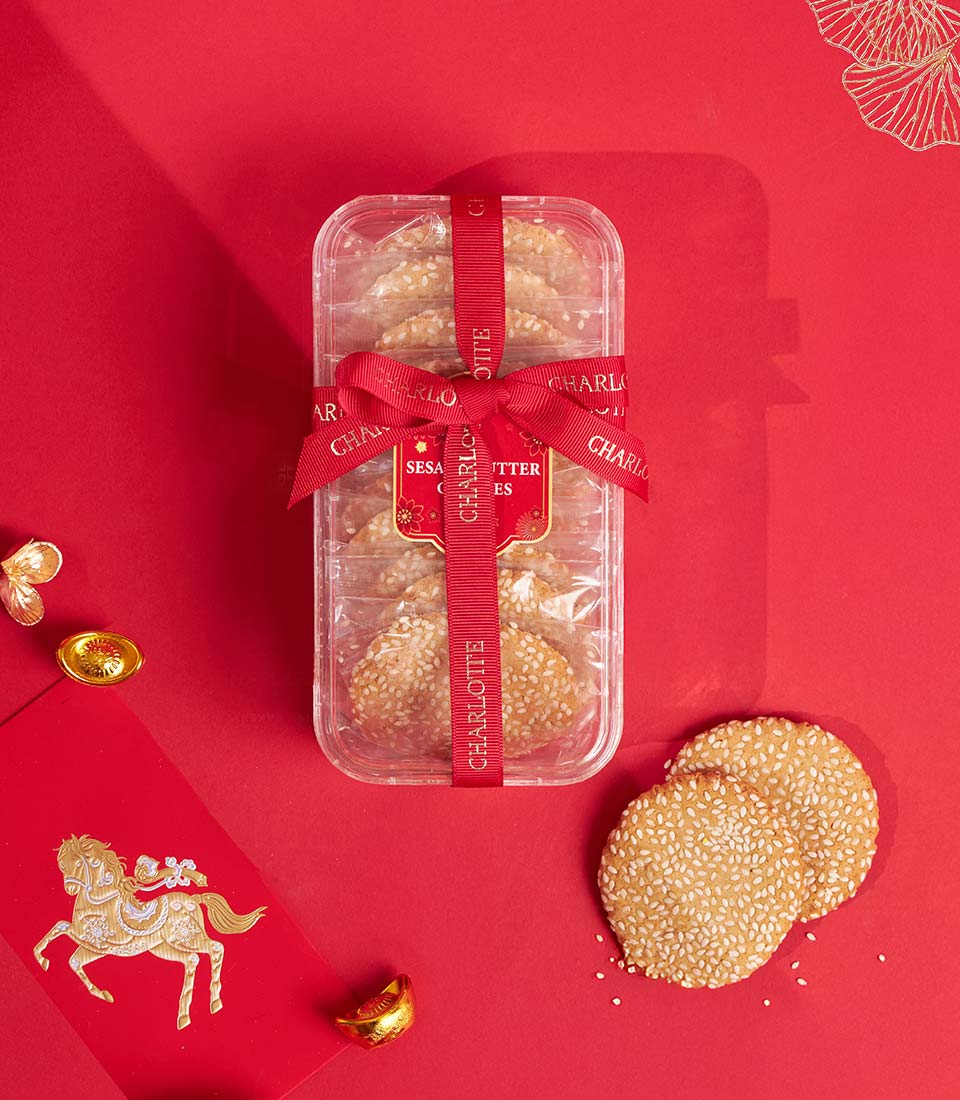 Charlotte honey sesame cookies in Chinese New Year gift packaging for festive gifting.