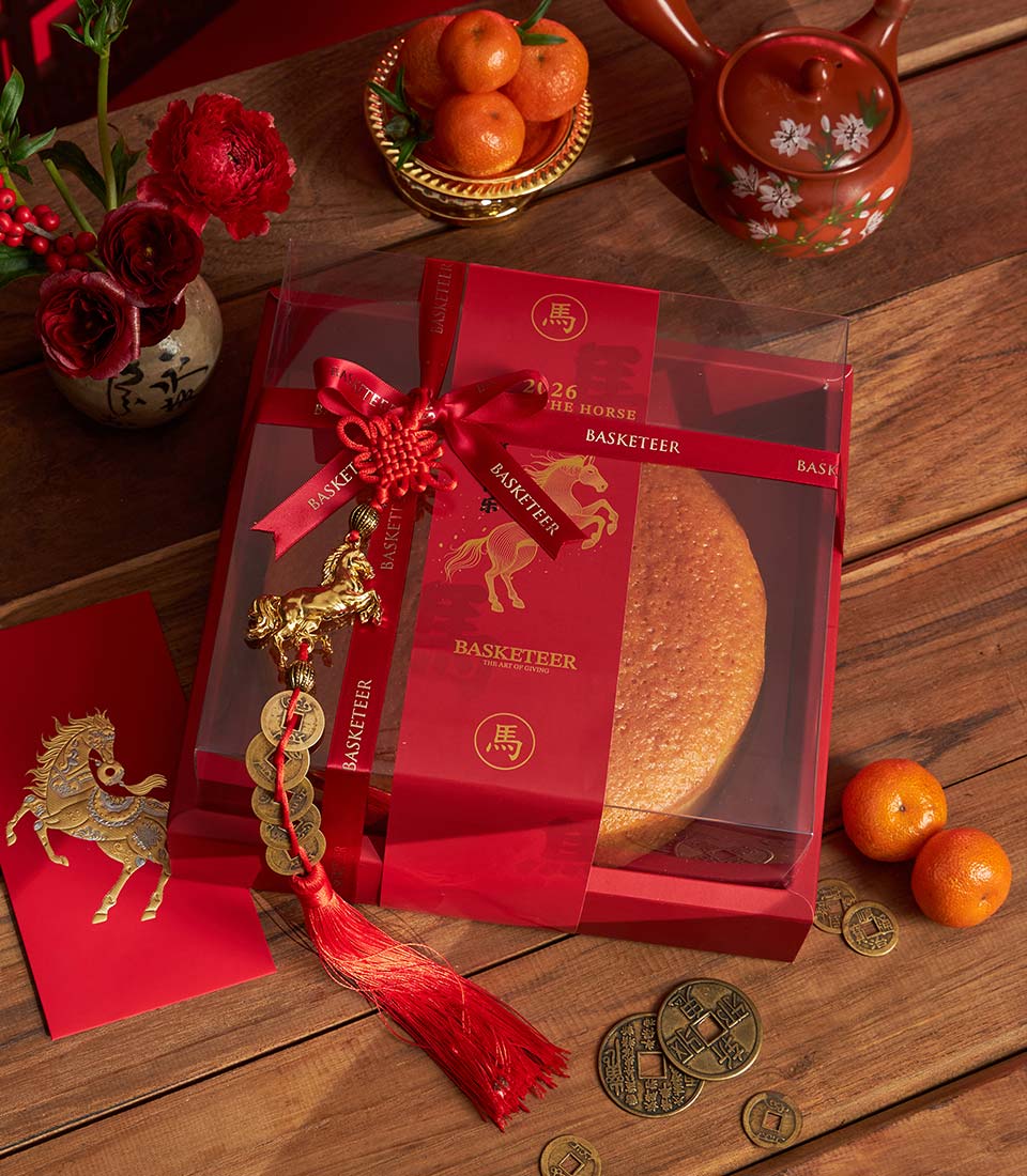 Chinese New Year mandarin orange sponge blessing cake in festive red packaging