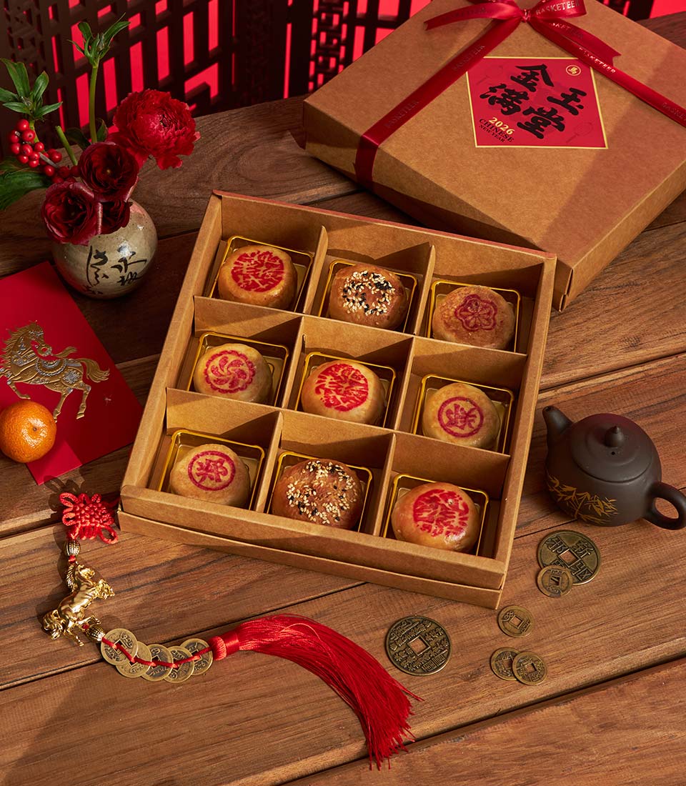Traditional Chinese New Year pastry gift box in red packaging with assorted pastries