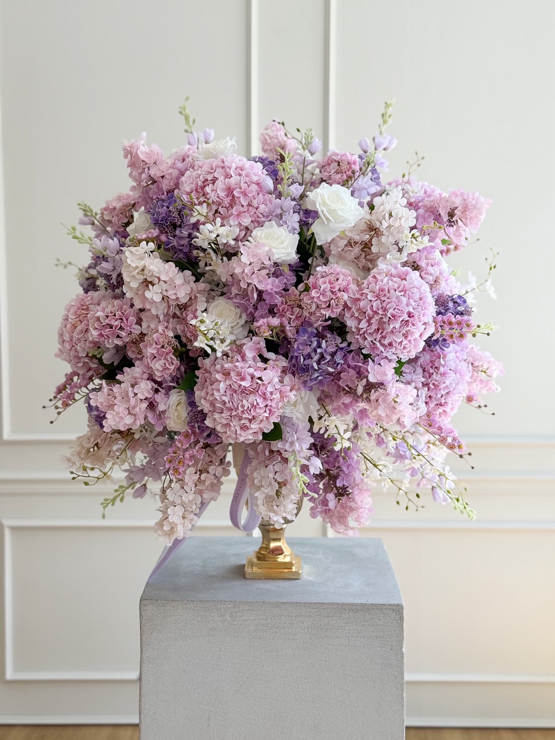 Flowers by Basketeer pastel hydrangea arrangement with soft pink and lilac blooms styled as an elegant floral centerpiece in Bangkok.