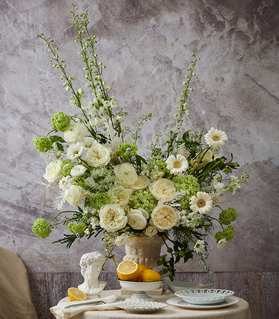 White and green flower bouquet with roses and fresh seasonal blooms in airy natural arrangement Bangkok delivery