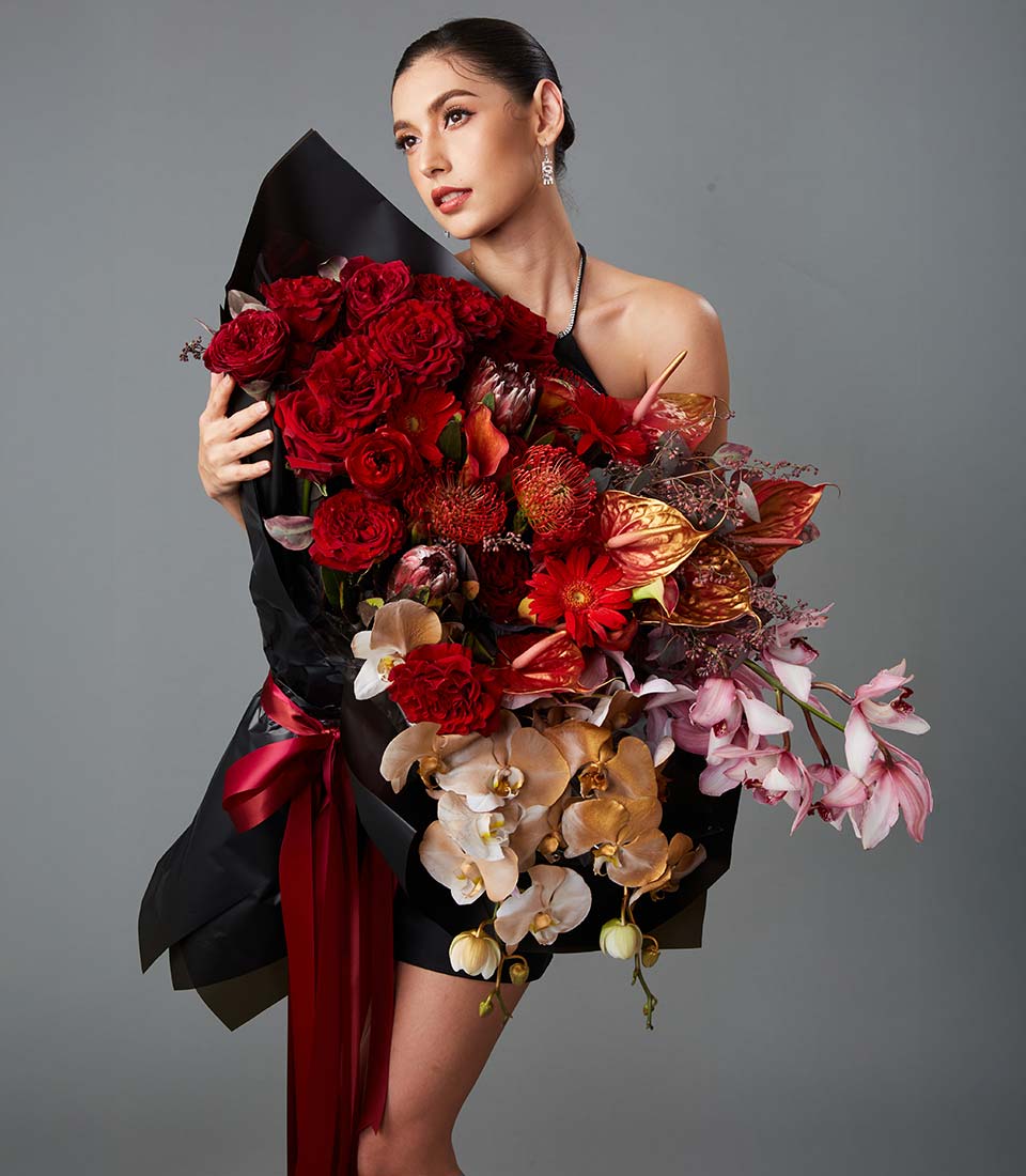 Luxury red flower bouquet with roses and premium blooms in bold elegant arrangement Bangkok delivery