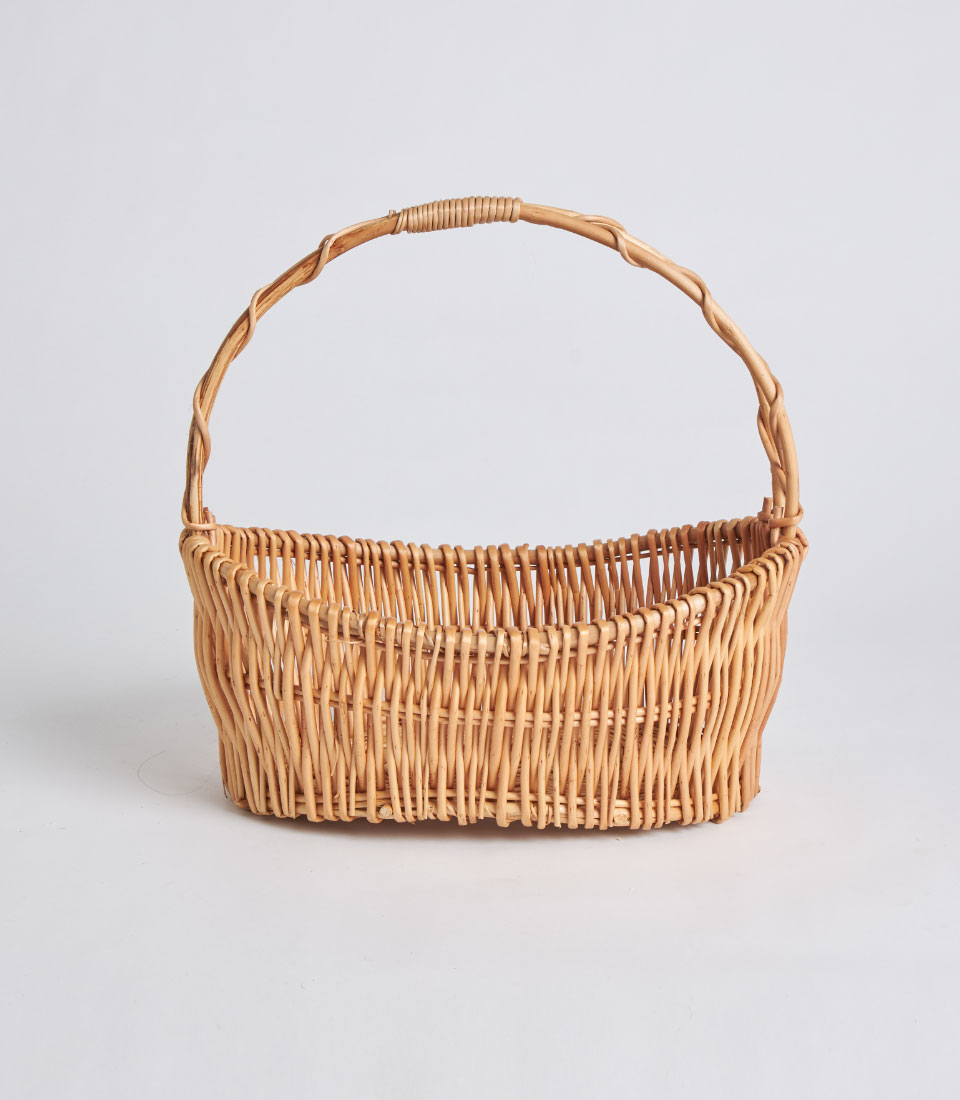 Front view of handcrafted curved-shaped wicker basket SKU BK-520