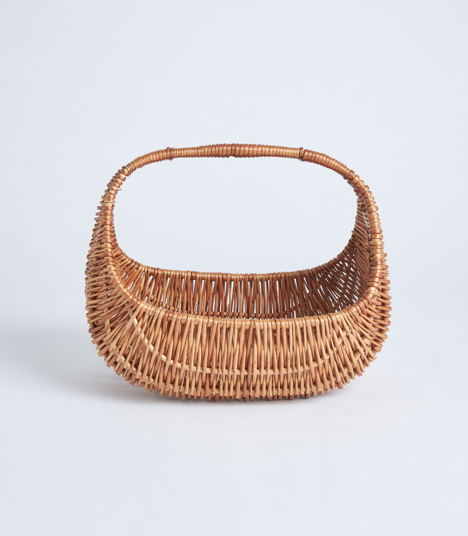 Front view of handcrafted curved wicker basket SKU BK-332