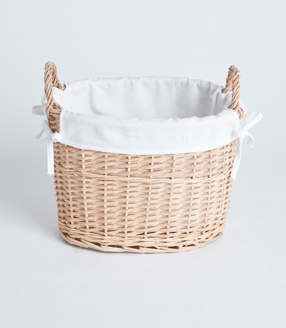 Front view of oval wicker basket with white fabric lining and side handles BK-095