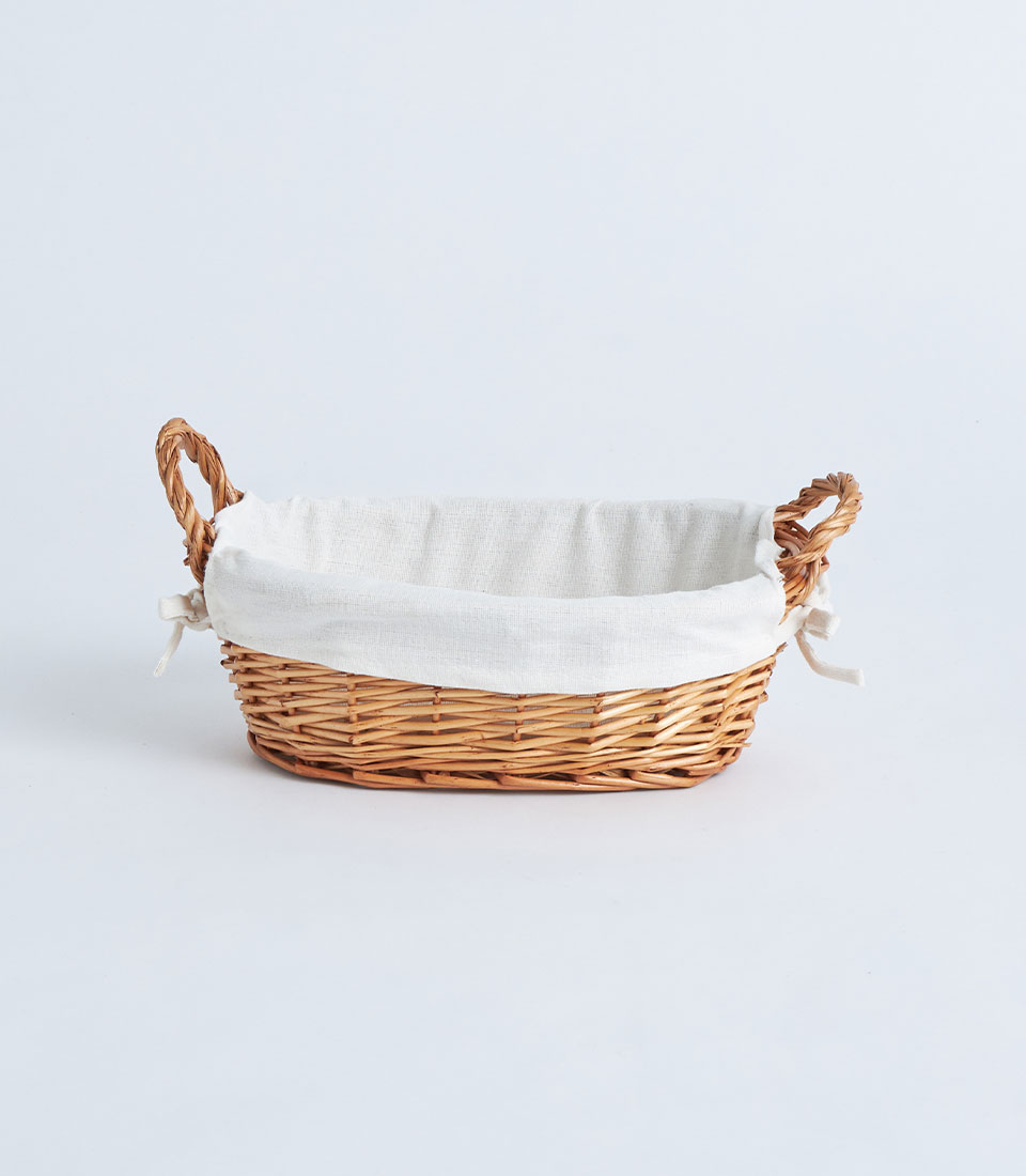 Front view oval wicker gift basket with white fabric lining BK-410