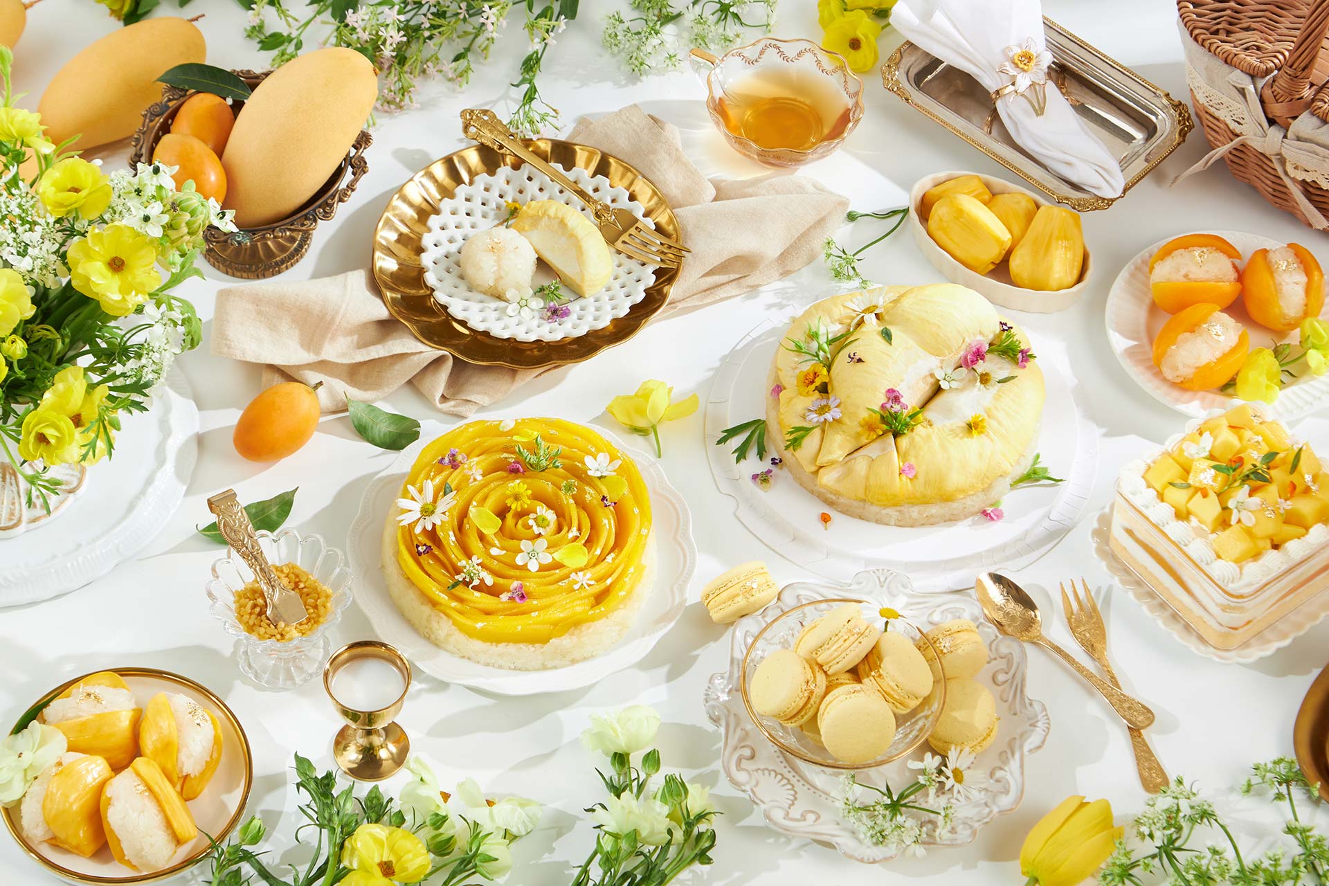 thai summer desserts including mango sticky rice cake durian cheesecake and mayongchid desserts on elegant table bakery collection bangkok