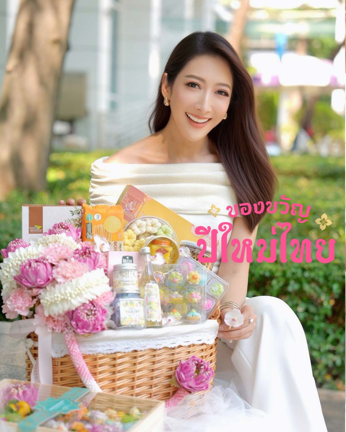 Songkran gift basket with lotus flowers, Thai desserts, and premium items for Thai New Year gifting